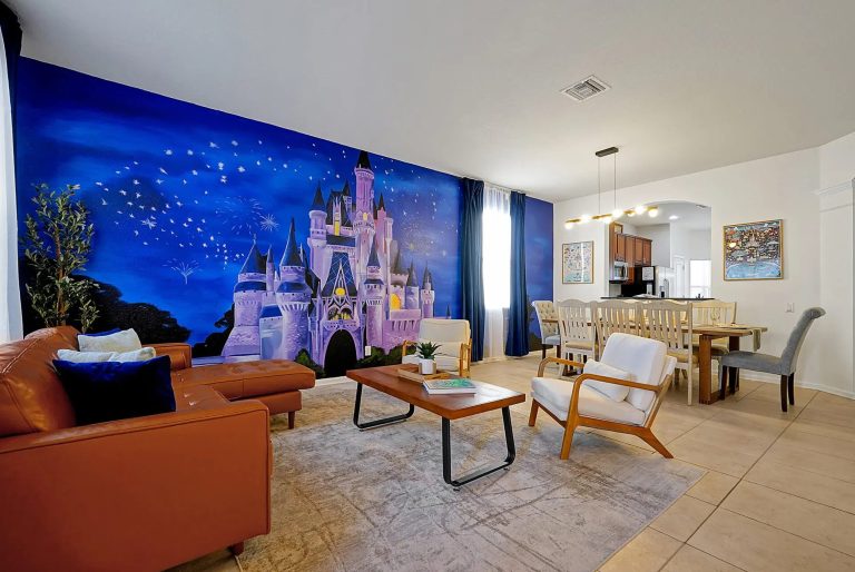 Living area featuring a castle mural, blue walls, and modern furnishings.