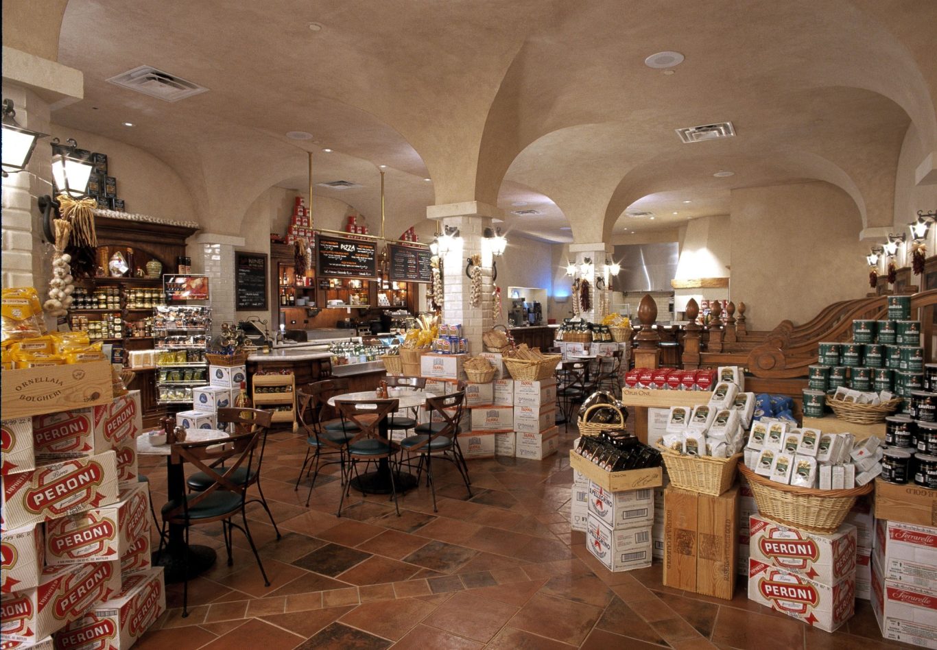 Interior of a rustic shop filled with shelves of various products and traditional decor.