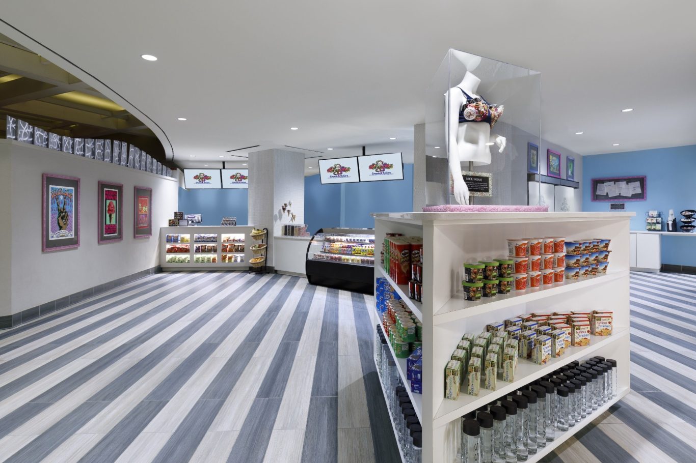 Modern interior of a shop with striped flooring and product displays.