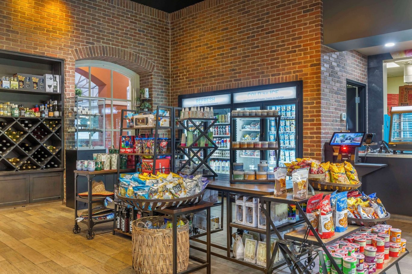 Corner store displaying shelves of snacks and beverages in a modern setting.