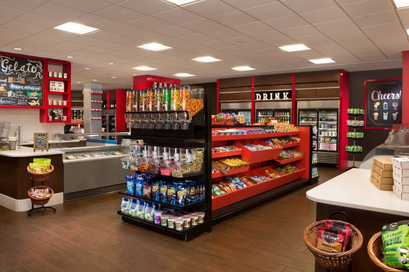 Interior of a convenience store with shelves of snacks and beverages displayed.