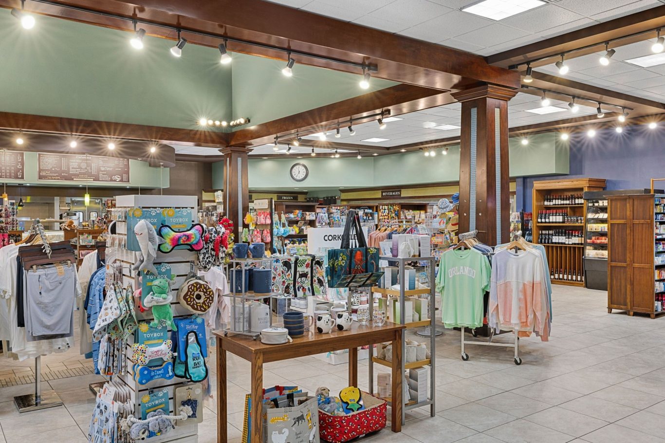 A well-lit retail store displaying various clothing and accessories on racks and shelves.