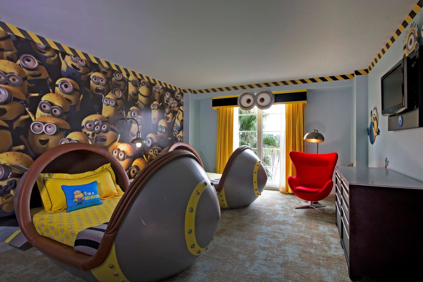 A brightly decorated children's room featuring Minion-themed beds and playful decor.
